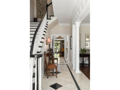 This elegant home with stunning finishes is nestled privately on on Woodside Plantation Country Club in South Carolina - for sale on GolfHomes.com, golf home, golf lot