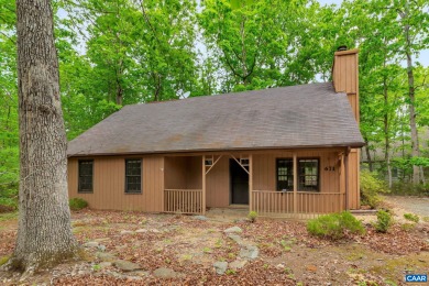 Vacation year round in this charming cottage on large wooded low on Lake Monticello Golf Course in Virginia - for sale on GolfHomes.com, golf home, golf lot