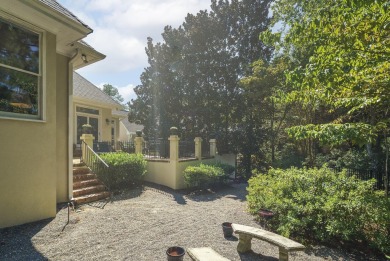 This elegant home with stunning finishes is nestled privately on on Woodside Plantation Country Club in South Carolina - for sale on GolfHomes.com, golf home, golf lot