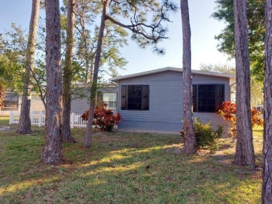 Unfurnished 2-bedroom, 2-bath manufactured home in Pine Lakes on Lake Fairways Country Club in Florida - for sale on GolfHomes.com, golf home, golf lot