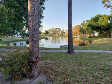 Unfurnished 2-bedroom, 2-bath manufactured home in Pine Lakes on Lake Fairways Country Club in Florida - for sale on GolfHomes.com, golf home, golf lot