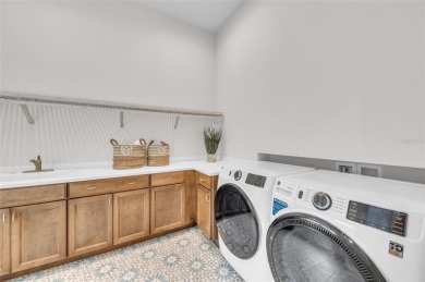 Come home to this magnificent custom coastal contemporary Lee on The Founders Golf Club in Florida - for sale on GolfHomes.com, golf home, golf lot