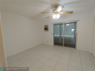 AFFORDABLE WINTER GET-AWAY!! GROUND FLOOR IN MOVE-IN CONDITION on Hillsboro Pines Golf in Florida - for sale on GolfHomes.com, golf home, golf lot