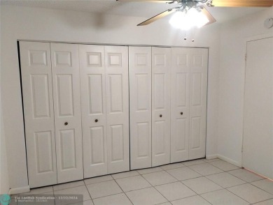 AFFORDABLE WINTER GET-AWAY!! GROUND FLOOR IN MOVE-IN CONDITION on Hillsboro Pines Golf in Florida - for sale on GolfHomes.com, golf home, golf lot