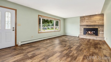 This home has had extreme care and is completely move in ready! on Escanaba Country Club in Michigan - for sale on GolfHomes.com, golf home, golf lot