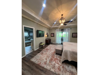 Nestled beneath an abundance of shade, located across the street on Legends Golf Course in Texas - for sale on GolfHomes.com, golf home, golf lot