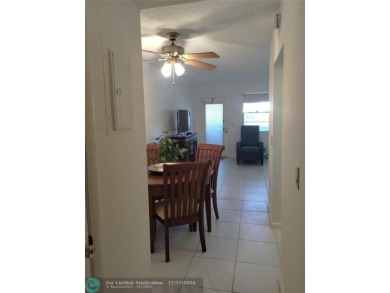 AFFORDABLE WINTER GET-AWAY!! GROUND FLOOR IN MOVE-IN CONDITION on Hillsboro Pines Golf in Florida - for sale on GolfHomes.com, golf home, golf lot