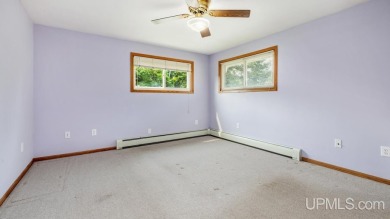 This home has had extreme care and is completely move in ready! on Escanaba Country Club in Michigan - for sale on GolfHomes.com, golf home, golf lot
