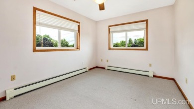 This home has had extreme care and is completely move in ready! on Escanaba Country Club in Michigan - for sale on GolfHomes.com, golf home, golf lot