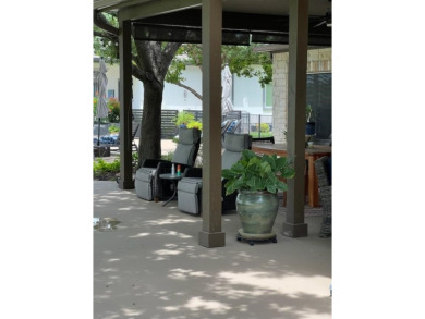 Nestled beneath an abundance of shade, located across the street on Legends Golf Course in Texas - for sale on GolfHomes.com, golf home, golf lot