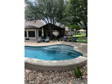 Nestled beneath an abundance of shade, located across the street on Legends Golf Course in Texas - for sale on GolfHomes.com, golf home, golf lot