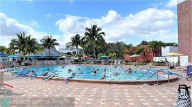 AFFORDABLE WINTER GET-AWAY!! GROUND FLOOR IN MOVE-IN CONDITION on Hillsboro Pines Golf in Florida - for sale on GolfHomes.com, golf home, golf lot
