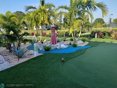 AFFORDABLE WINTER GET-AWAY!! GROUND FLOOR IN MOVE-IN CONDITION on Hillsboro Pines Golf in Florida - for sale on GolfHomes.com, golf home, golf lot