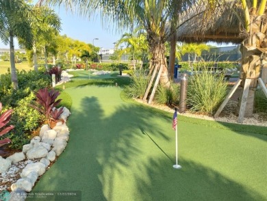 AFFORDABLE WINTER GET-AWAY!! GROUND FLOOR IN MOVE-IN CONDITION on Hillsboro Pines Golf in Florida - for sale on GolfHomes.com, golf home, golf lot