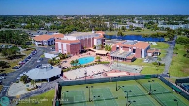 AFFORDABLE WINTER GET-AWAY!! GROUND FLOOR IN MOVE-IN CONDITION on Hillsboro Pines Golf in Florida - for sale on GolfHomes.com, golf home, golf lot