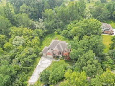 This stunning brick colonial home is nestled on a spacious and on Farmington Hills Golf Club in Michigan - for sale on GolfHomes.com, golf home, golf lot