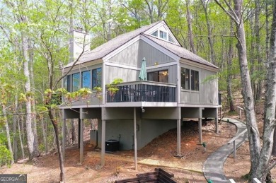 This spectacular villa offers seasonal views of Lake Petit and on Big Canoe Golf Club - Cherokee in Georgia - for sale on GolfHomes.com, golf home, golf lot