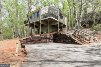 This spectacular villa offers seasonal views of Lake Petit and on Big Canoe Golf Club - Cherokee in Georgia - for sale on GolfHomes.com, golf home, golf lot