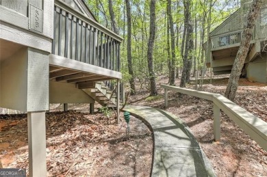This spectacular villa offers seasonal views of Lake Petit and on Big Canoe Golf Club - Cherokee in Georgia - for sale on GolfHomes.com, golf home, golf lot