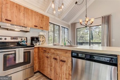 This spectacular villa offers seasonal views of Lake Petit and on Big Canoe Golf Club - Cherokee in Georgia - for sale on GolfHomes.com, golf home, golf lot
