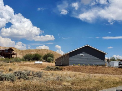 Check out the sweeping views of the golf course and Wind River on Antelope Hills Golf Course in Wyoming - for sale on GolfHomes.com, golf home, golf lot