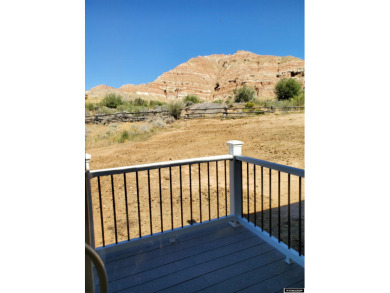 Check out the sweeping views of the golf course and Wind River on Antelope Hills Golf Course in Wyoming - for sale on GolfHomes.com, golf home, golf lot