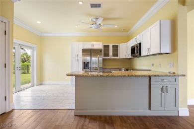 Luxury Waterfront Key West-Style Retreat on nearly 1/2 an acre on Sabal Trace Golf and Country Club in Florida - for sale on GolfHomes.com, golf home, golf lot