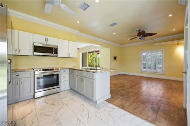 Luxury Waterfront Key West-Style Retreat on nearly 1/2 an acre on Sabal Trace Golf and Country Club in Florida - for sale on GolfHomes.com, golf home, golf lot
