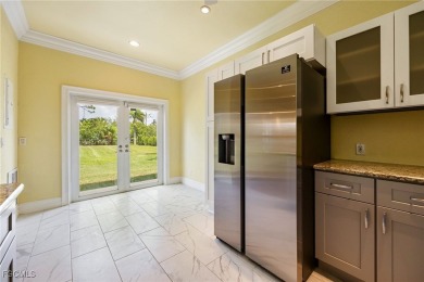 Luxury Waterfront Key West-Style Retreat on nearly 1/2 an acre on Sabal Trace Golf and Country Club in Florida - for sale on GolfHomes.com, golf home, golf lot