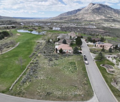 This prime half-acre lot, on top of the 18th tee box of on Battlement Mesa Golf Course in Colorado - for sale on GolfHomes.com, golf home, golf lot