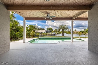 Luxury Waterfront Key West-Style Retreat on nearly 1/2 an acre on Sabal Trace Golf and Country Club in Florida - for sale on GolfHomes.com, golf home, golf lot