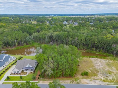 Build your custom dream home on this 0.44 acre lagoon front lot on Savannah Quarters Country Club in Georgia - for sale on GolfHomes.com, golf home, golf lot