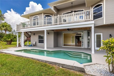 Luxury Waterfront Key West-Style Retreat on nearly 1/2 an acre on Sabal Trace Golf and Country Club in Florida - for sale on GolfHomes.com, golf home, golf lot