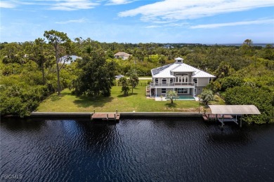 Luxury Waterfront Key West-Style Retreat on nearly 1/2 an acre on Sabal Trace Golf and Country Club in Florida - for sale on GolfHomes.com, golf home, golf lot