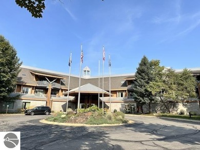 Enjoy views of the 18th hole and pond at the Lodge at Cedar on Schuss Mountain Golf Club in Michigan - for sale on GolfHomes.com, golf home, golf lot