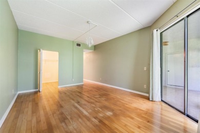Welcome to this inviting FIRST FLOOR condo in the gated on East Lake Woodlands Country Club in Florida - for sale on GolfHomes.com, golf home, golf lot