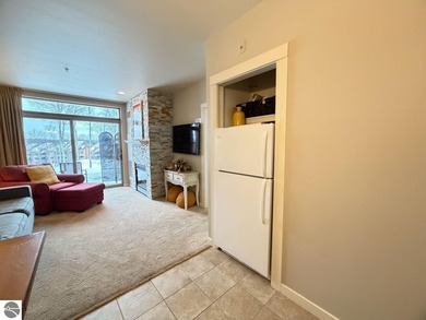 Enjoy views of the 18th hole and pond at the Lodge at Cedar on Schuss Mountain Golf Club in Michigan - for sale on GolfHomes.com, golf home, golf lot