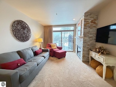 Enjoy views of the 18th hole and pond at the Lodge at Cedar on Schuss Mountain Golf Club in Michigan - for sale on GolfHomes.com, golf home, golf lot