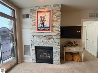 Enjoy views of the 18th hole and pond at the Lodge at Cedar on Schuss Mountain Golf Club in Michigan - for sale on GolfHomes.com, golf home, golf lot