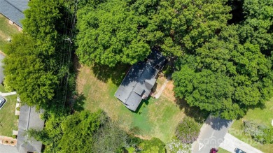 Discover this charming brick home in Revolution Park, minutes on Carolina Golf Club in North Carolina - for sale on GolfHomes.com, golf home, golf lot