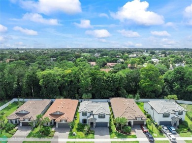 Beautifully upgraded pool home on the golf course. Boasting 4 on Woodmont Country Club in Florida - for sale on GolfHomes.com, golf home, golf lot