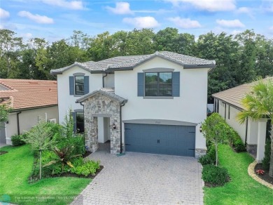 Beautifully upgraded pool home on the golf course. Boasting 4 on Woodmont Country Club in Florida - for sale on GolfHomes.com, golf home, golf lot