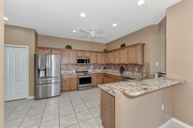 HERON CREEK VILLA ON THE LAKE! Welcome to your dream retreat in on Heron Creek Golf and Country Club in Florida - for sale on GolfHomes.com, golf home, golf lot