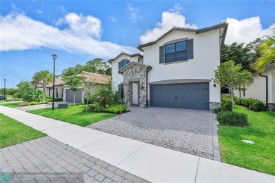 Beautifully upgraded pool home on the golf course. Boasting 4 on Woodmont Country Club in Florida - for sale on GolfHomes.com, golf home, golf lot