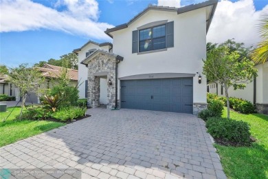 Beautifully upgraded pool home on the golf course. Boasting 4 on Woodmont Country Club in Florida - for sale on GolfHomes.com, golf home, golf lot