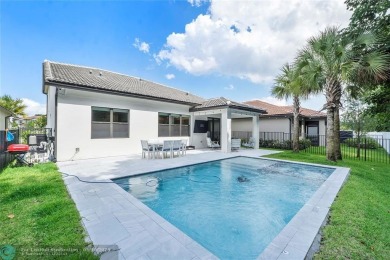 Beautifully upgraded pool home on the golf course. Boasting 4 on Woodmont Country Club in Florida - for sale on GolfHomes.com, golf home, golf lot