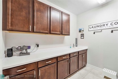 Beautifully upgraded pool home on the golf course. Boasting 4 on Woodmont Country Club in Florida - for sale on GolfHomes.com, golf home, golf lot