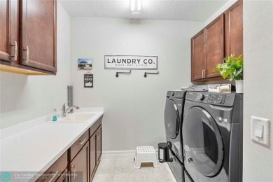 Beautifully upgraded pool home on the golf course. Boasting 4 on Woodmont Country Club in Florida - for sale on GolfHomes.com, golf home, golf lot