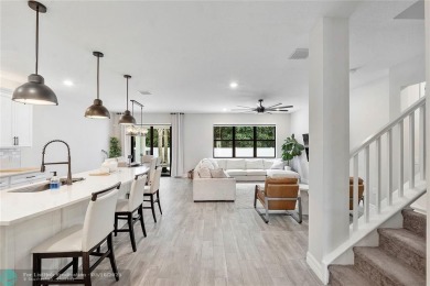 Beautifully upgraded pool home on the golf course. Boasting 4 on Woodmont Country Club in Florida - for sale on GolfHomes.com, golf home, golf lot