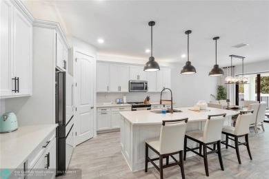Beautifully upgraded pool home on the golf course. Boasting 4 on Woodmont Country Club in Florida - for sale on GolfHomes.com, golf home, golf lot